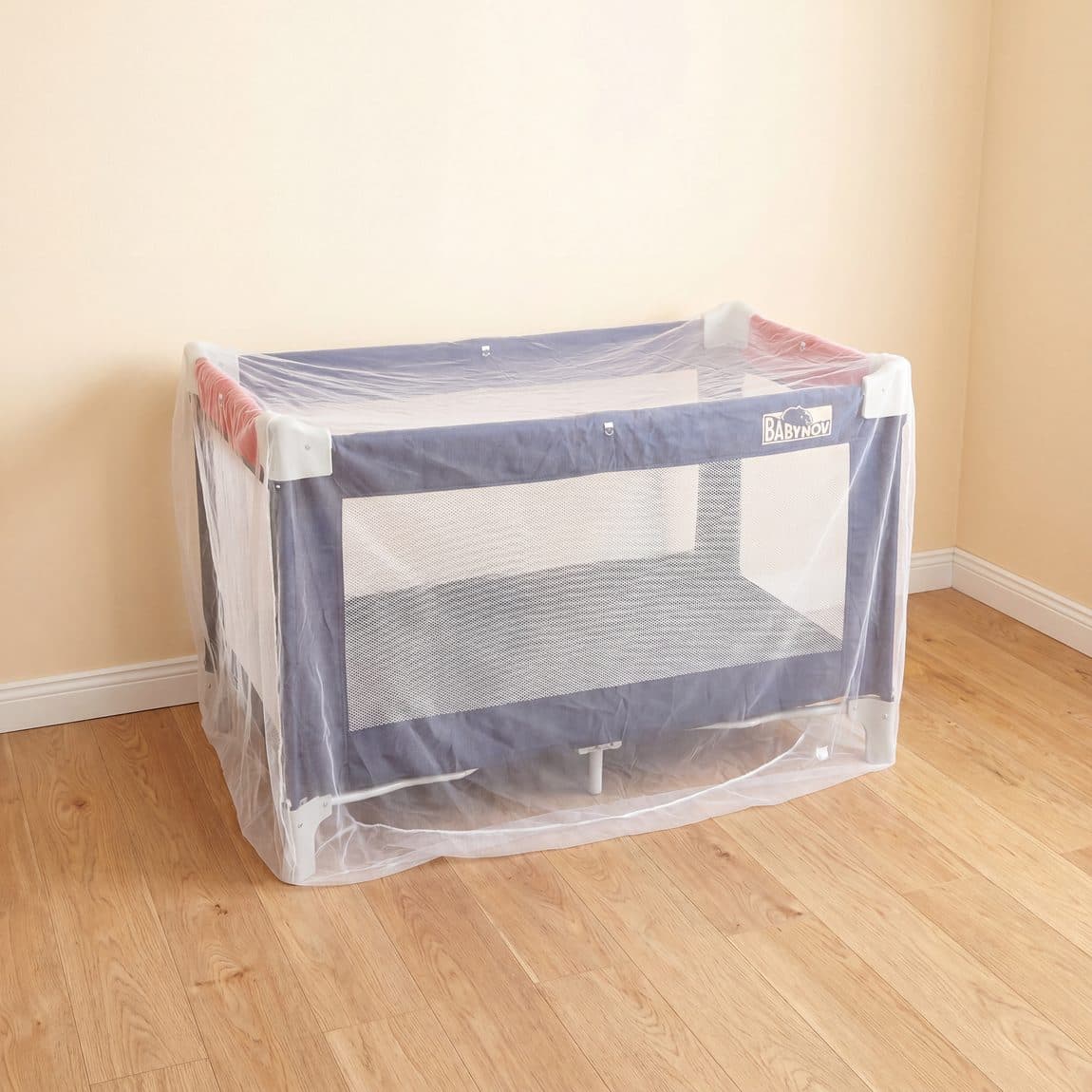 Mosticare Bambino Dorme coated cot net over a crib